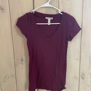 Maroon t shirt.